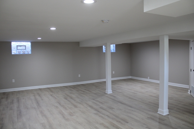 724 Barnsdale Road, Unit 2 La Grange Park, IL 60526 - Photo 16 of 20 an empty room with wooden floor and door