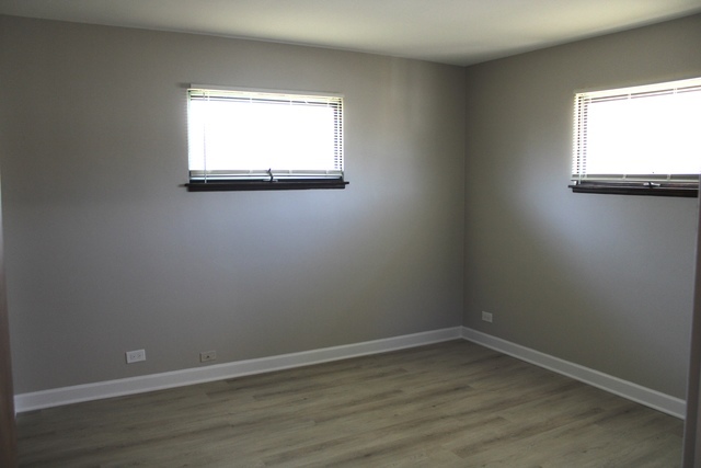 724 Barnsdale Road, Unit 2 La Grange Park, IL 60526 - Photo 9 of 20 an empty room with a window