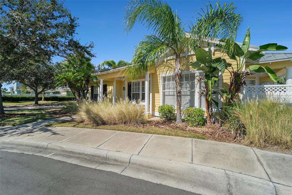 5516 Luminar Pointe Lane Apollo Beach, FL 33572 - Photo 2 of 34 a front view of house with yard and green space