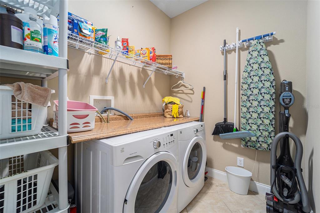 5516 Luminar Pointe Lane Apollo Beach, FL 33572 - Photo 21 of 34 a utility room with dryer and washer