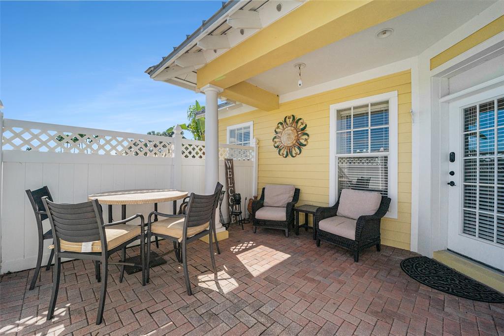 5516 Luminar Pointe Lane Apollo Beach, FL 33572 - Photo 28 of 34 a patio with patio couch and table