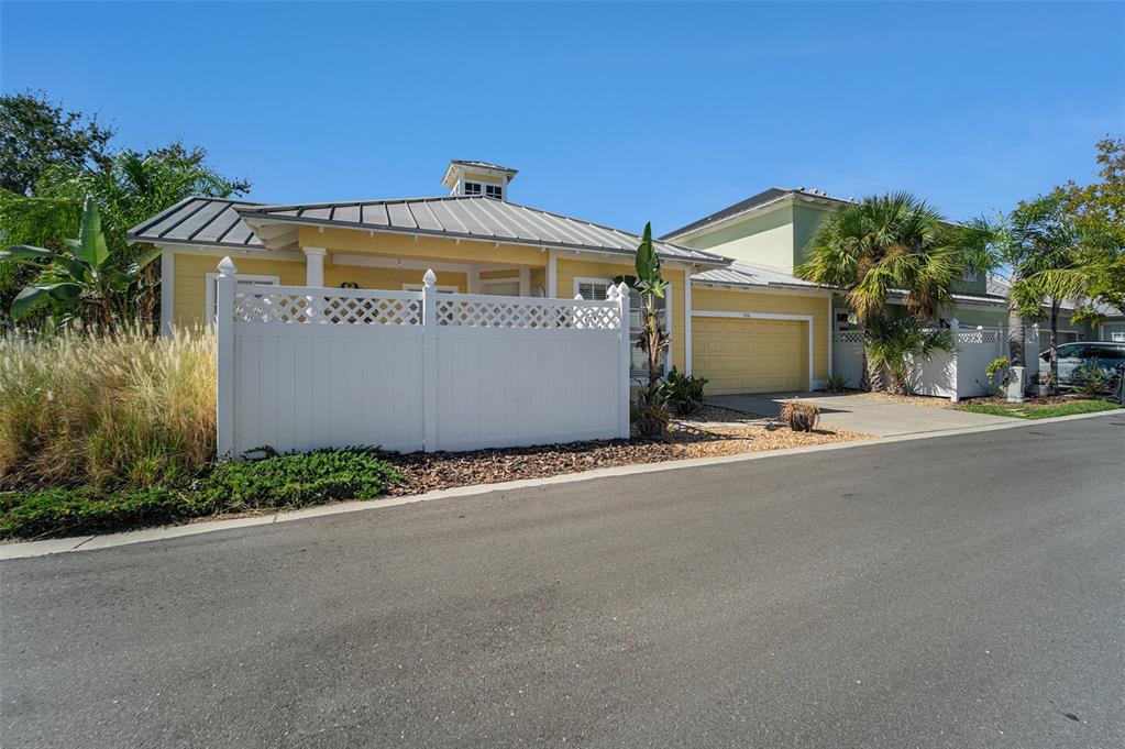 5516 Luminar Pointe Lane Apollo Beach, FL 33572 - Photo 30 of 34 a front view of a house with a yard and garage