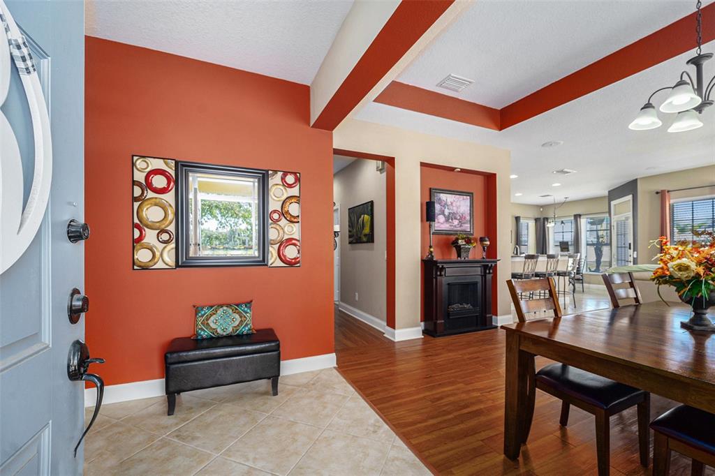 5516 Luminar Pointe Lane Apollo Beach, FL 33572 - Photo 5 of 34 a living room with furniture and wooden floor