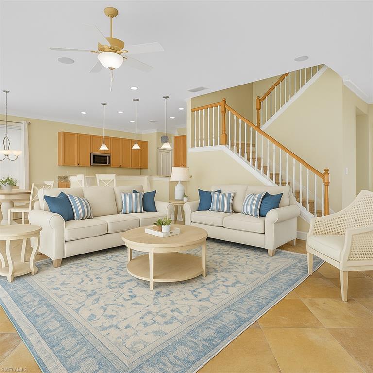 9983 Colonial Walk North Estero, FL 33928 - Photo 11 of 39 a living room with furniture and a dining table