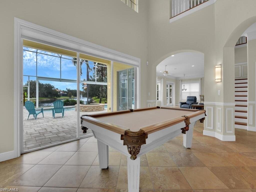 9983 Colonial Walk North Estero, FL 33928 - Photo 15 of 39 a living room with a large window and furniture