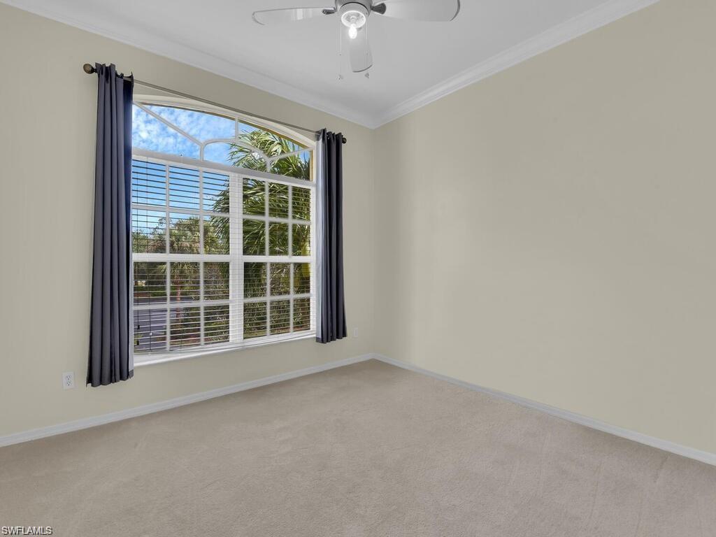 9983 Colonial Walk North Estero, FL 33928 - Photo 19 of 39 a view of an empty room with a window