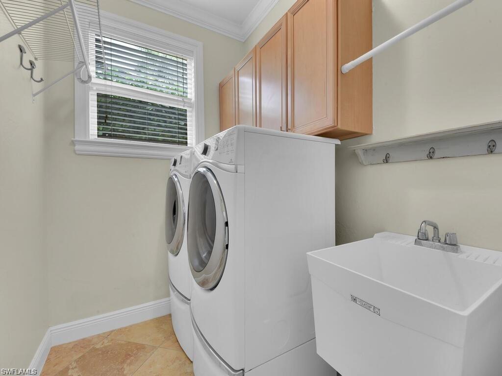 9983 Colonial Walk North Estero, FL 33928 - Photo 20 of 39 a utility room with dryer and washer