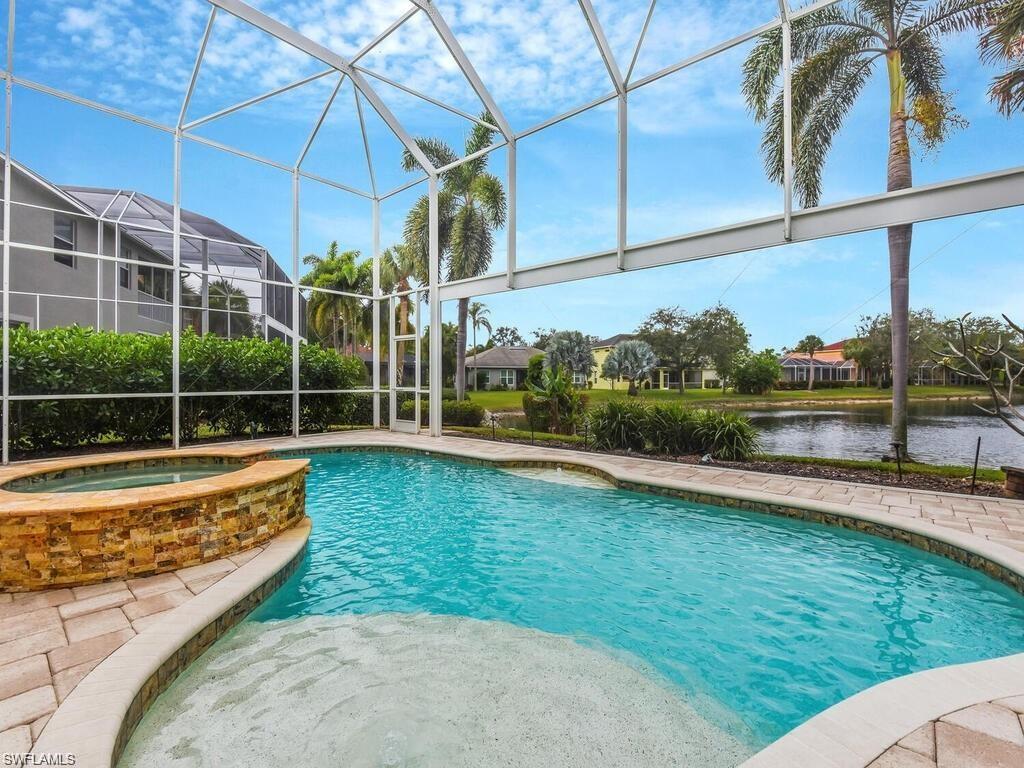 9983 Colonial Walk North Estero, FL 33928 - Photo 2 of 39 a view of a backyard with swimming pool
