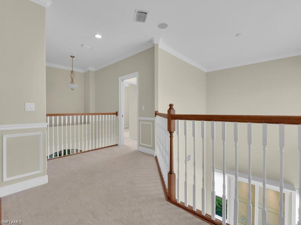 9983 Colonial Walk North Estero, FL 33928 - Photo 21 of 39 a view of a hallway