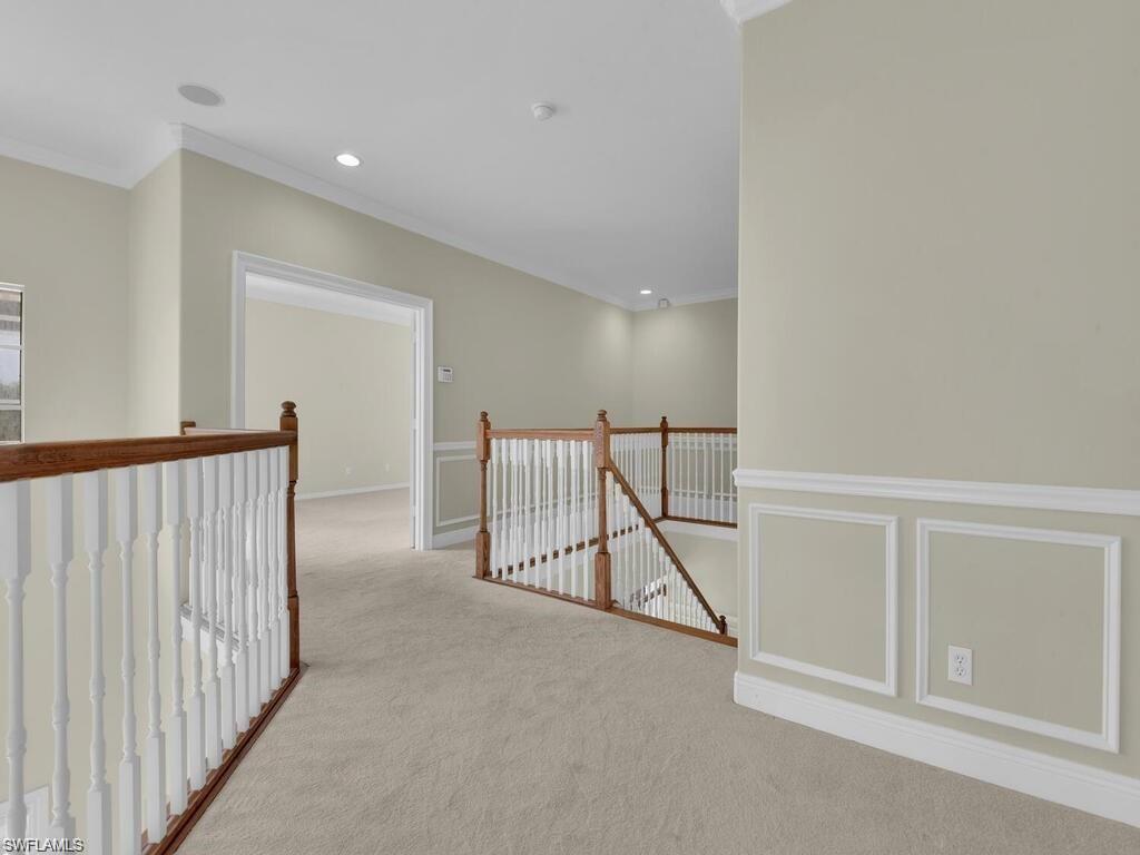 9983 Colonial Walk North Estero, FL 33928 - Photo 22 of 39 a view of a hallway with staircase