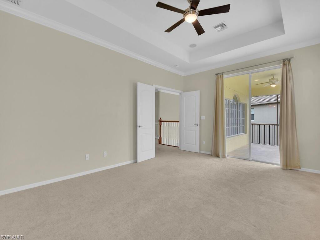 9983 Colonial Walk North Estero, FL 33928 - Photo 23 of 39 a view of a livingroom with a ceiling fan and entryway