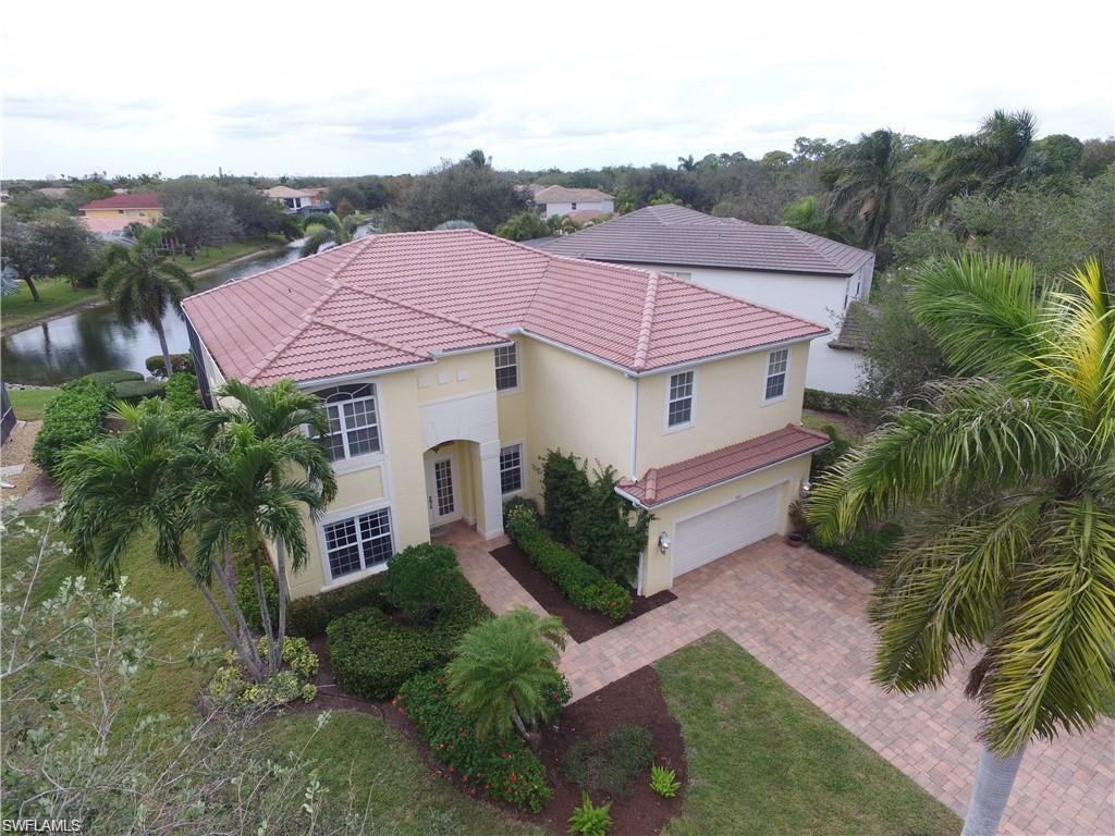 9983 Colonial Walk North Estero, FL 33928 - Photo 33 of 39 a aerial view of a house with a yard and potted plants