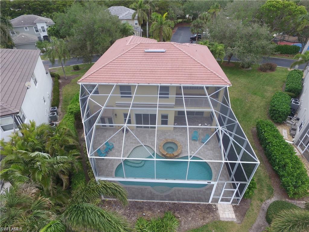 9983 Colonial Walk North Estero, FL 33928 - Photo 34 of 39 a front view of a house with a yard