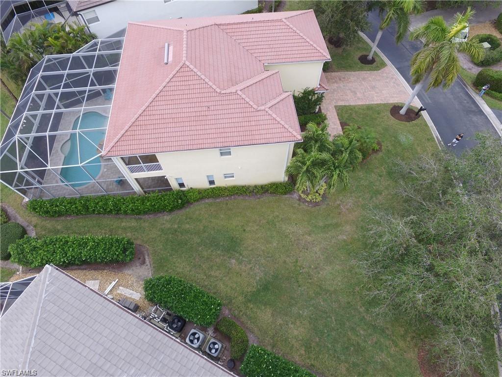 9983 Colonial Walk North Estero, FL 33928 - Photo 35 of 39 a aerial view of a house with a yard and plants