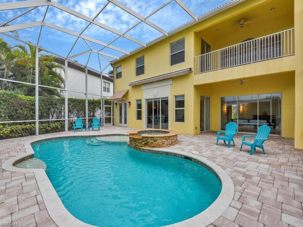 9983 Colonial Walk North Estero, FL 33928 - Photo 4 of 39 a view of a swimming pool with a patio