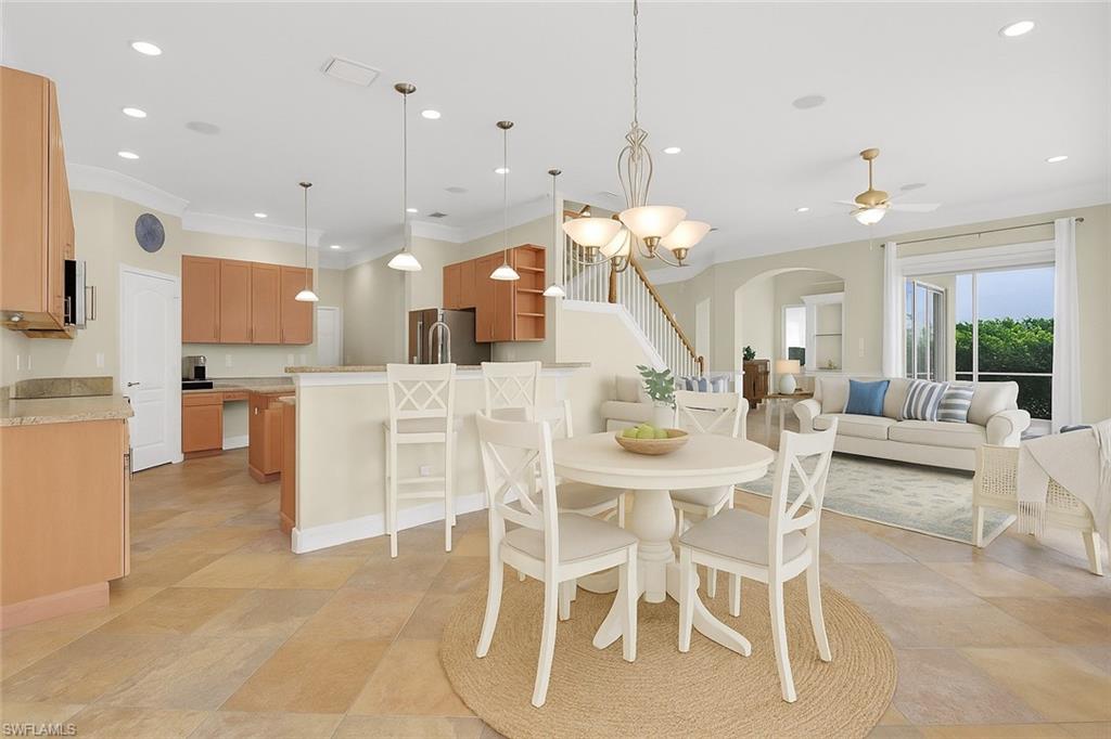 9983 Colonial Walk North Estero, FL 33928 - Photo 9 of 39 a large kitchen with a table and chairs