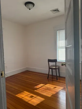 a view of room with a table and chair