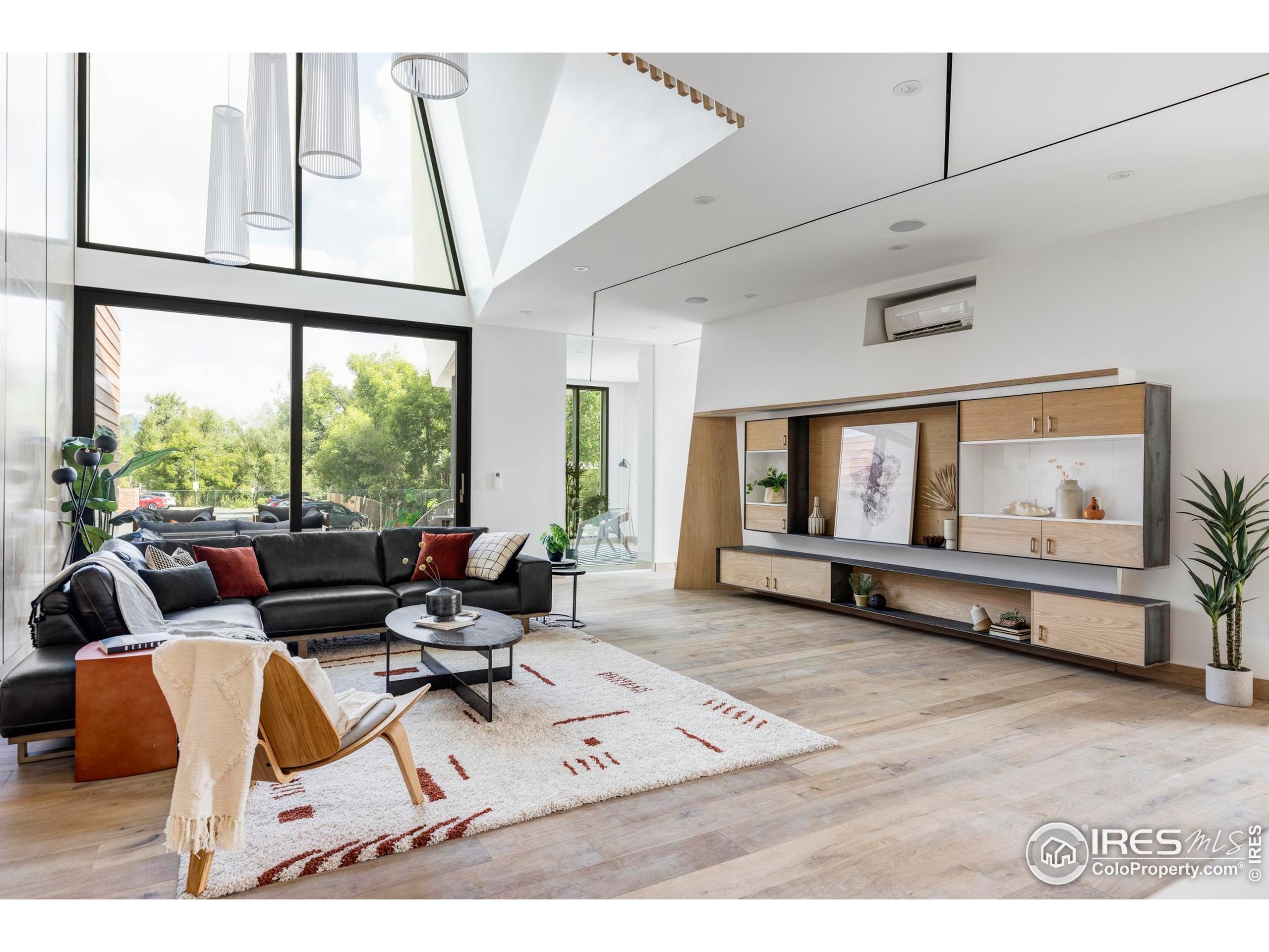 944 Arapahoe Avenue, Unit A Boulder, CO 80302 - Photo 14 of 36 a living room with furniture and large window