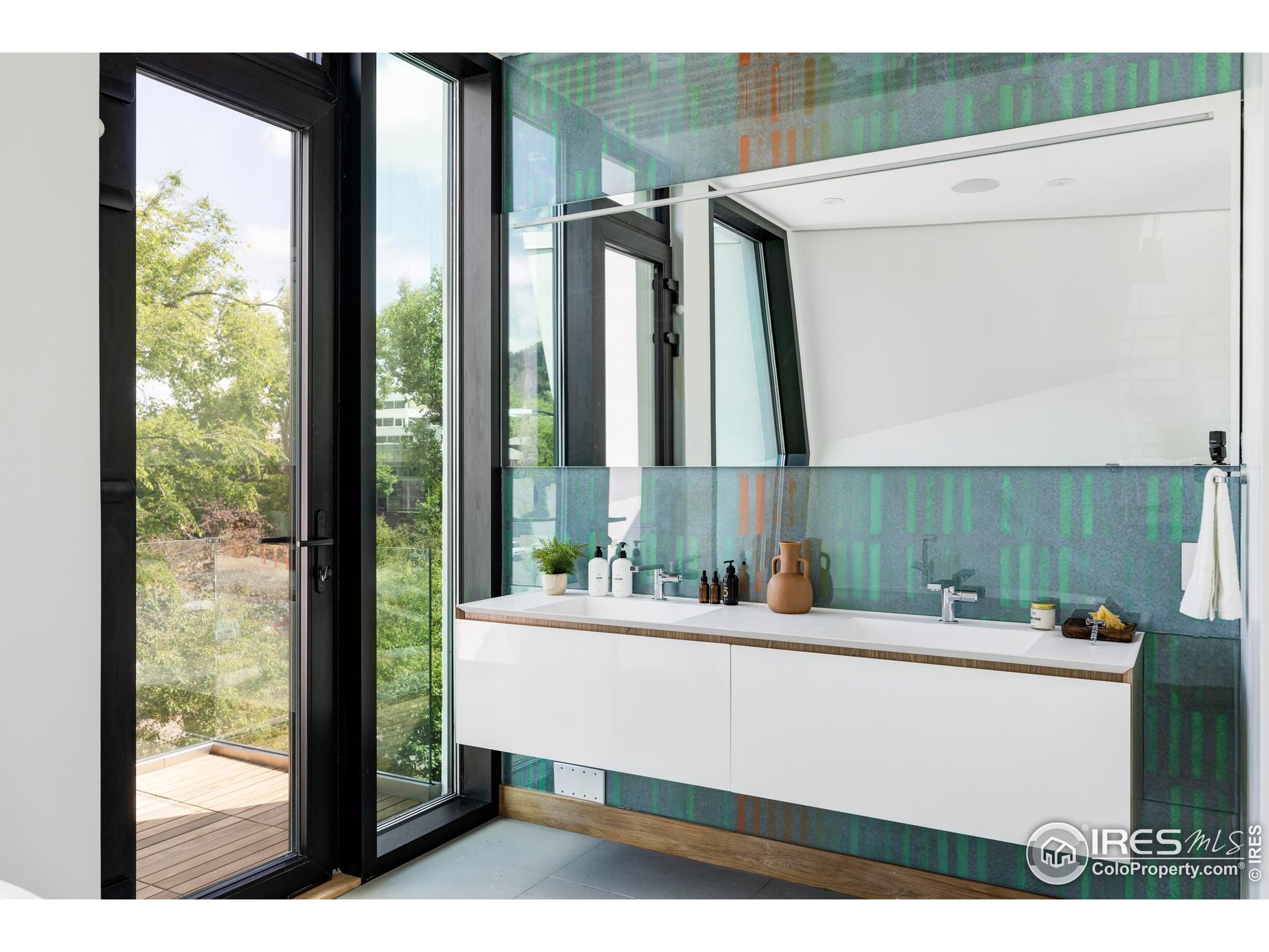 944 Arapahoe Avenue, Unit A Boulder, CO 80302 - Photo 32 of 36 a bathroom with a sink and a mirror