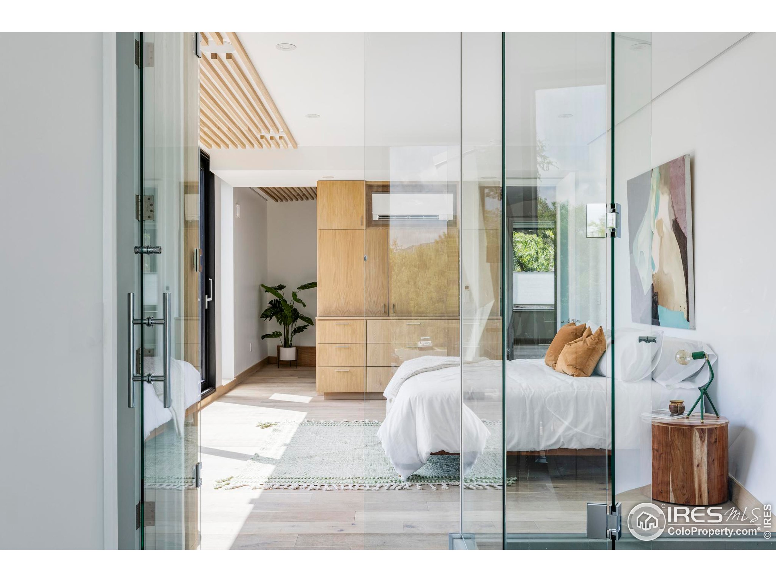 944 Arapahoe Avenue, Unit A Boulder, CO 80302 - Photo 34 of 36 a bedroom with furniture and a window