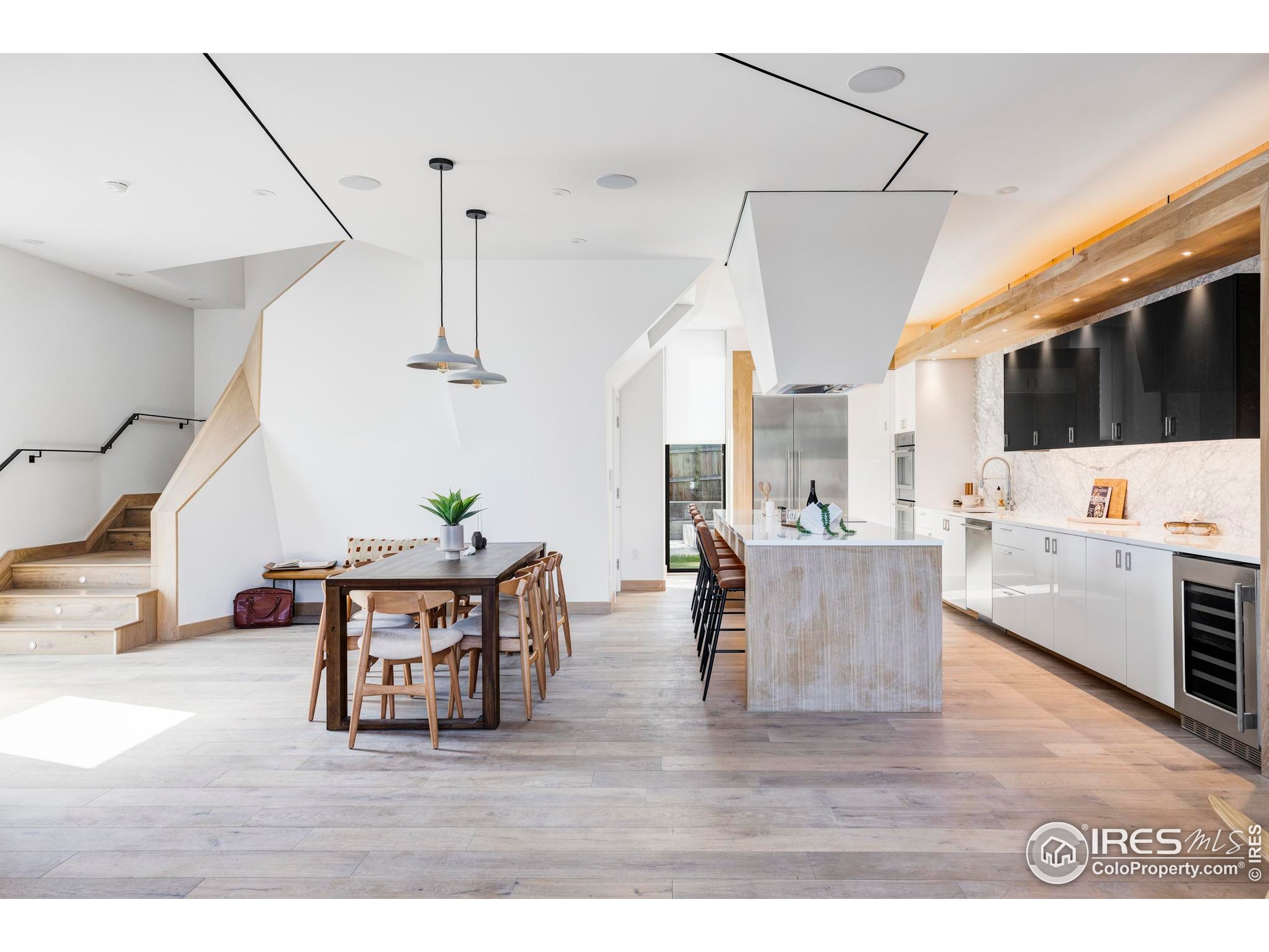 944 Arapahoe Avenue, Unit A Boulder, CO 80302 - Photo 6 of 36 a living room with furniture and a flat screen tv