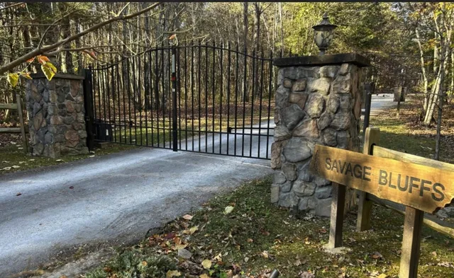 a view of a bench with wooden fence