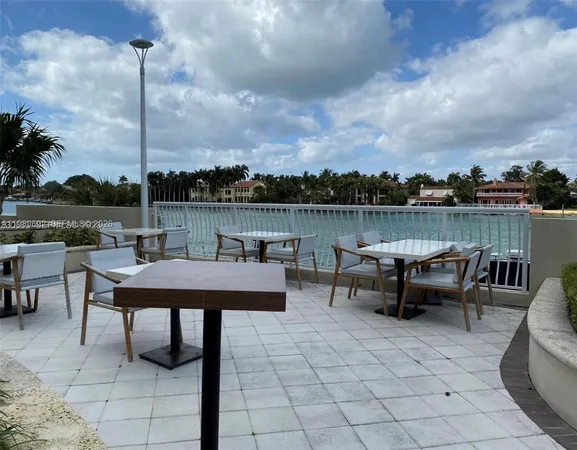 a living room with fireplace furniture and a chandelier