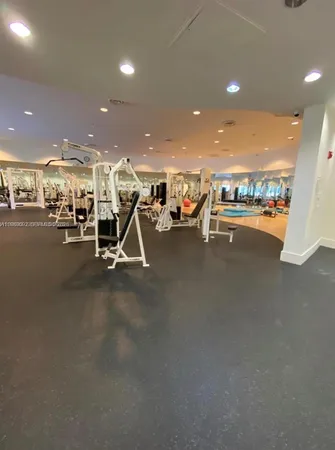 a en suite bathroom with a sink double vanity and a mirror