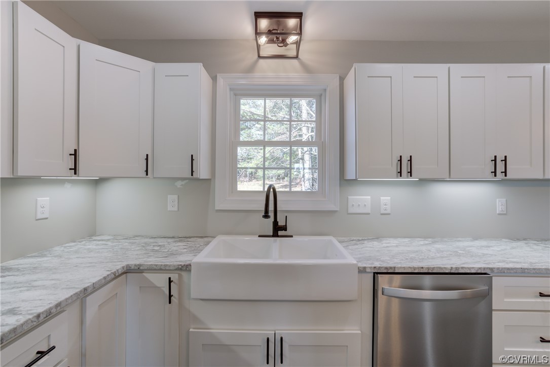0 Lincoln Road Hanover, VA 23069 - Photo 12 of 36 a kitchen with granite countertop a sink white cabinets and a window