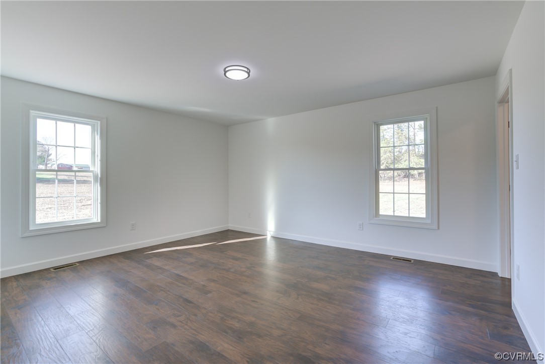 0 Lincoln Road Hanover, VA 23069 - Photo 23 of 36 an empty room with wooden floor and windows