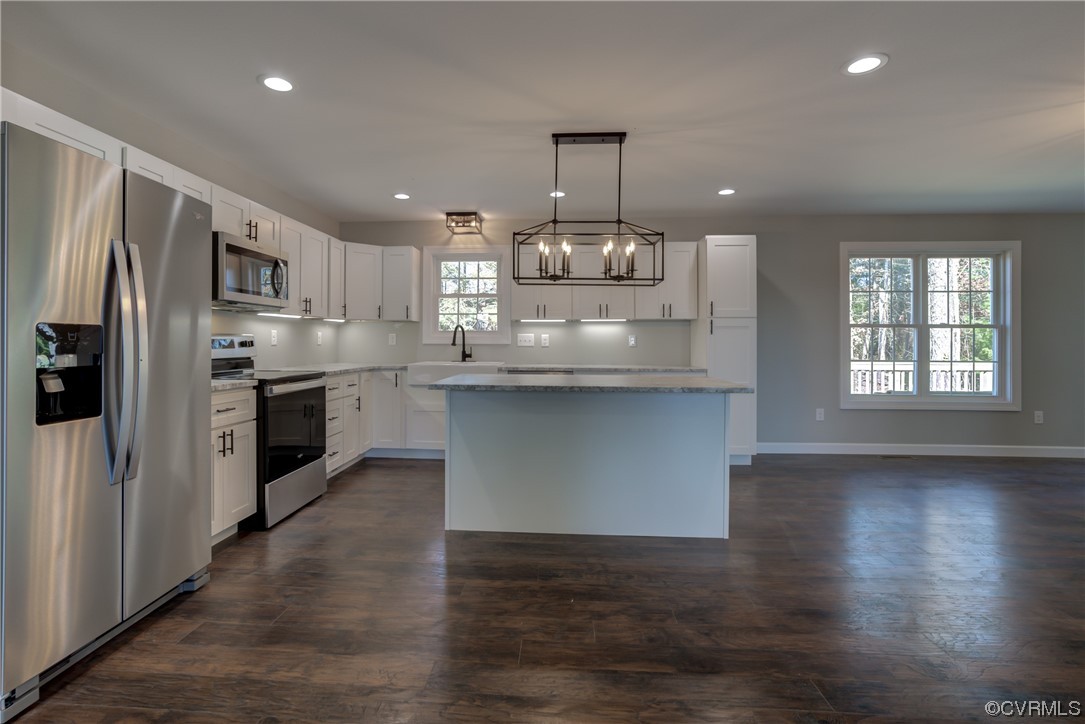 0 Lincoln Road Hanover, VA 23069 - Photo 9 of 36 a kitchen with stainless steel appliances granite countertop wooden floors and white cabinets