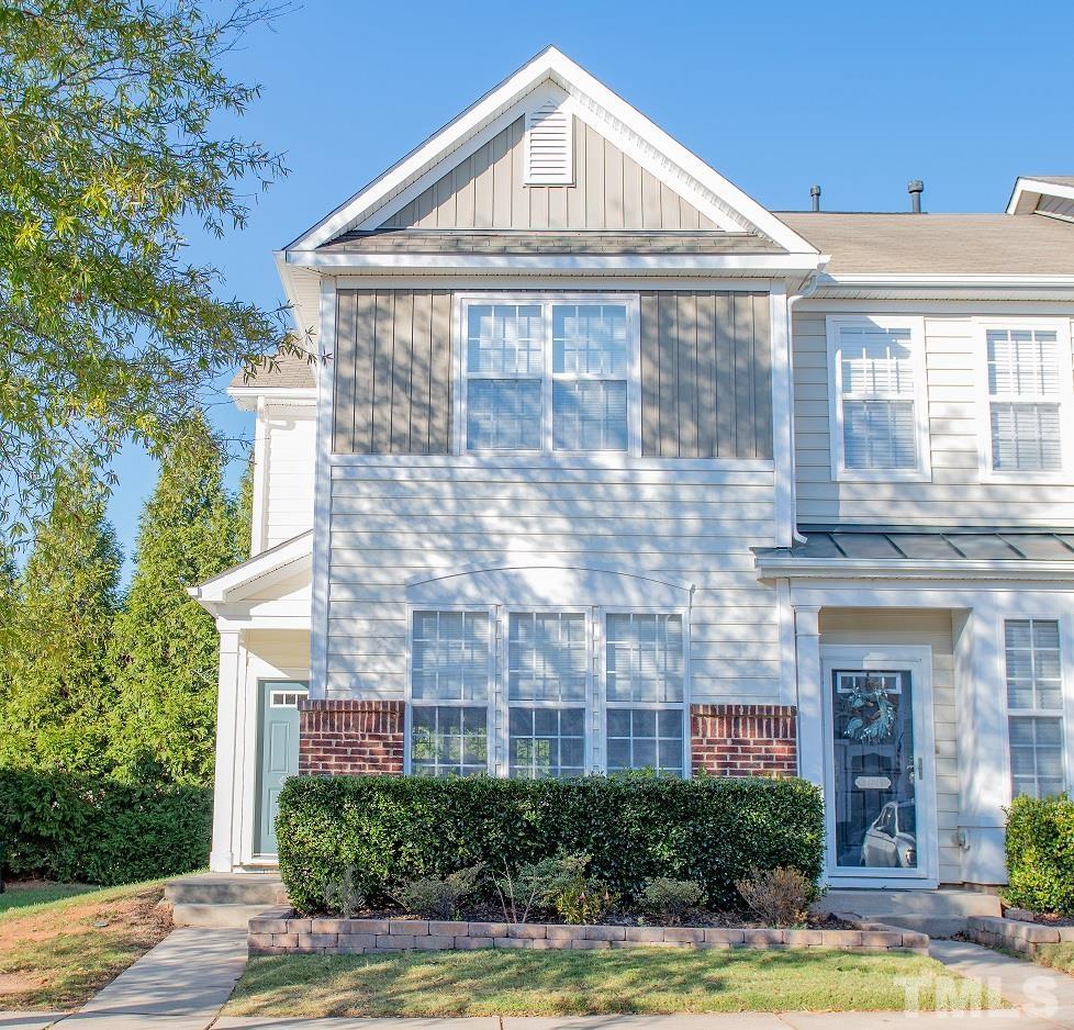7826 Silverthread Lane Raleigh, NC 27617 - Photo 1 of 14 a front view of a house with a yard