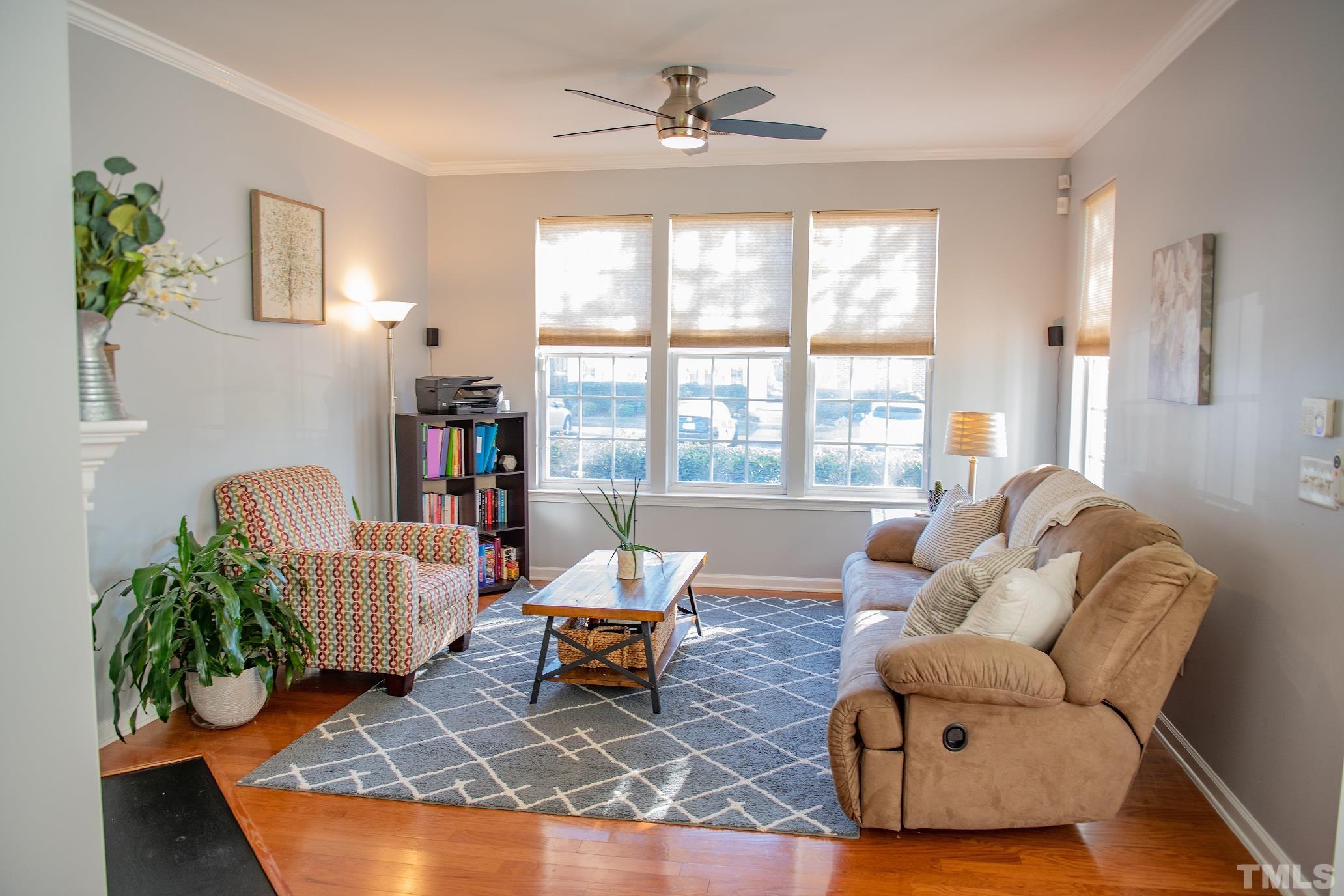 7826 Silverthread Lane Raleigh, NC 27617 - Photo 2 of 14 a living room with furniture and a large window