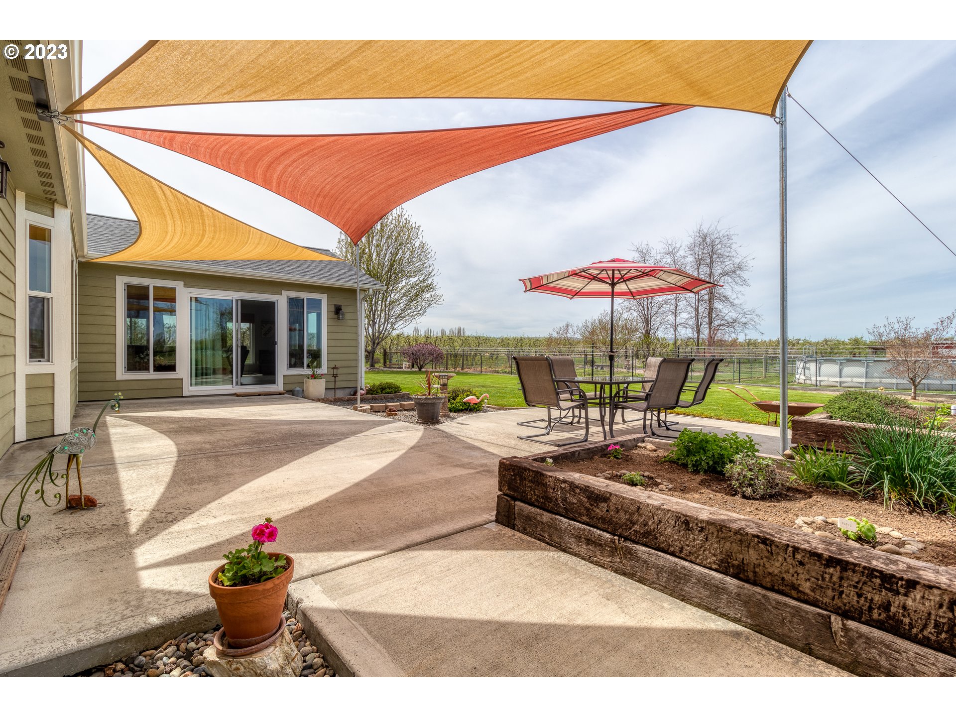 52794 Appleton Road Milton Freewater, OR 97862 - Photo 22 of 35 a view of a house with a swimming pool and sitting area