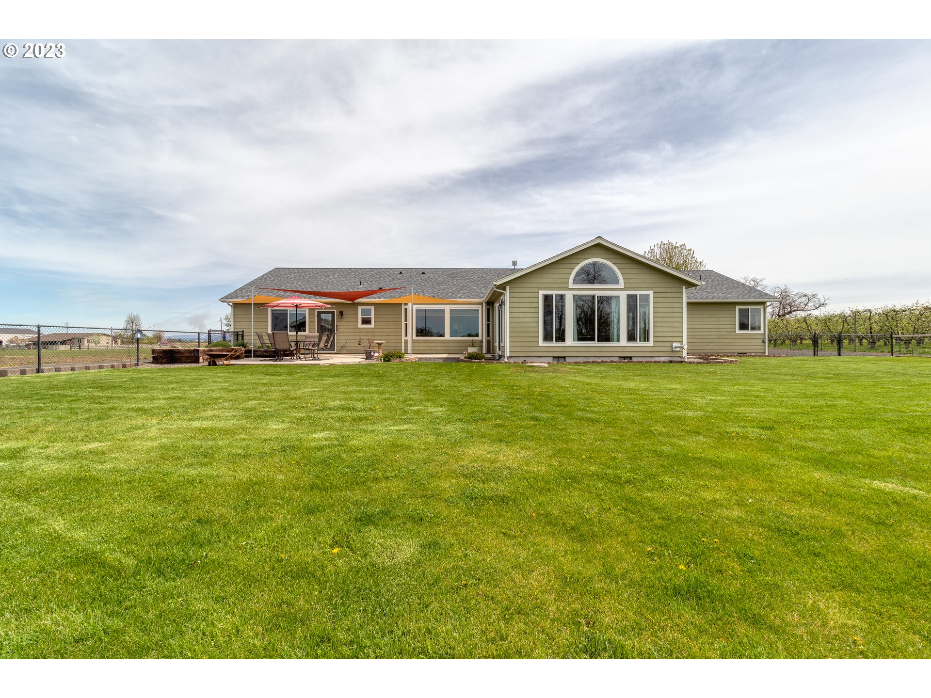 52794 Appleton Road Milton Freewater, OR 97862 - Photo 24 of 35 a view of a house with a big yard and large trees
