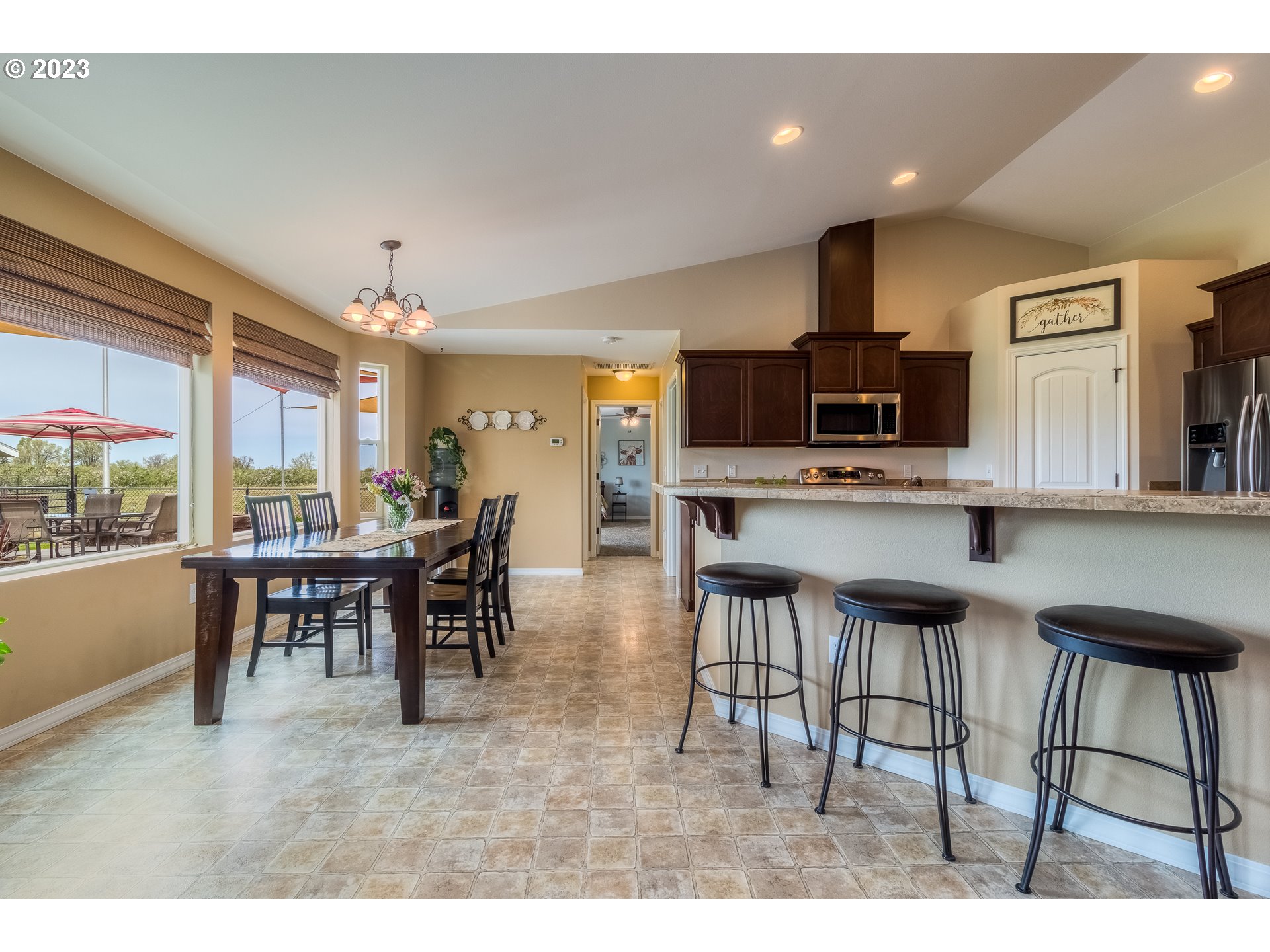 52794 Appleton Road Milton Freewater, OR 97862 - Photo 7 of 35 a view of kitchen with kitchen island dining table and chairs