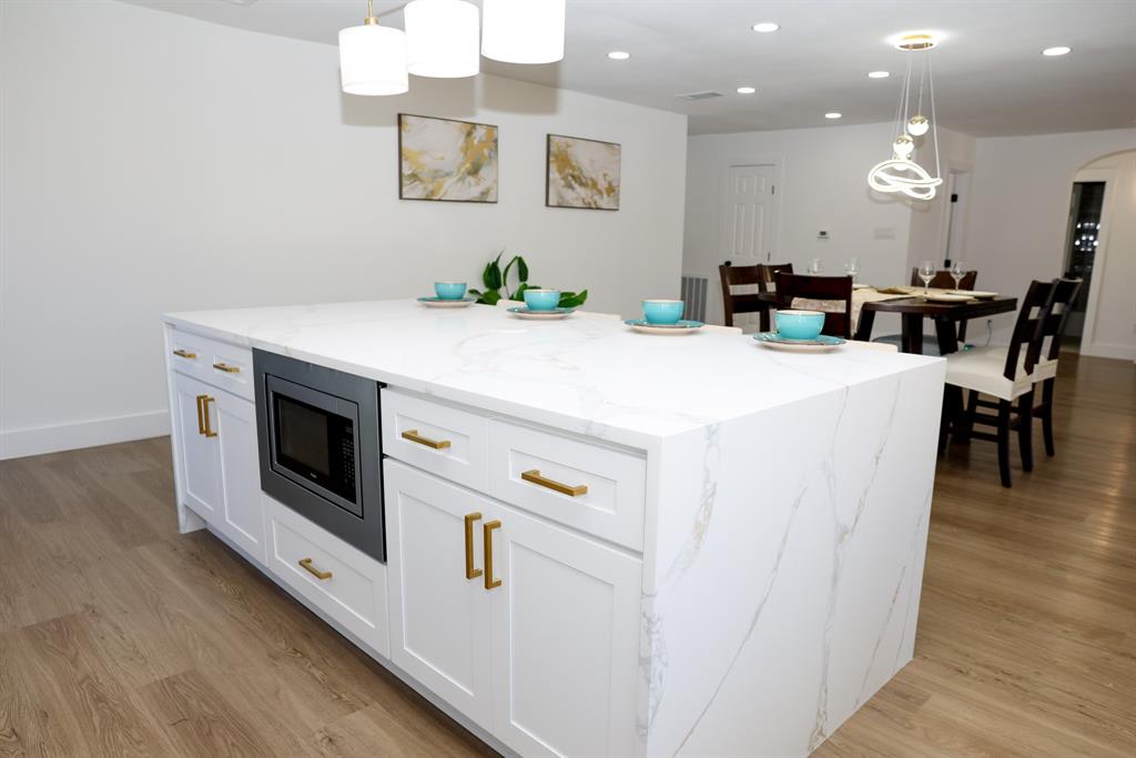 6508 Ember Court Plano, TX 75023 - Photo 4 of 38 Kitchen island with waterfall edge