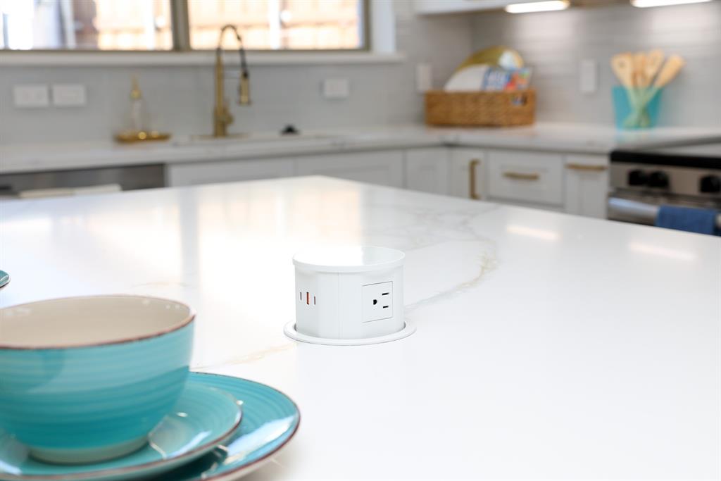 6508 Ember Court Plano, TX 75023 - Photo 5 of 38 Island with pop-up outlet