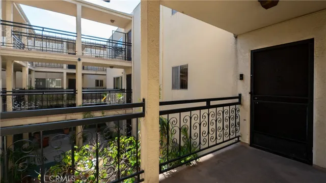 a view of a balcony with a potted plant