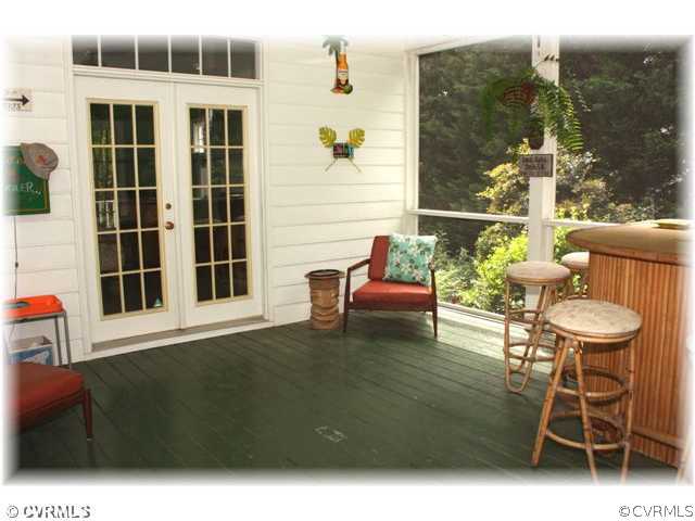14420 Newgate Road Midlothian, VA 23113 - Photo 10 of 12 a balcony with table and chairs