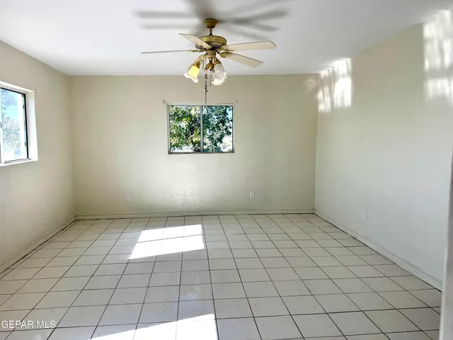 a view of an empty room and window