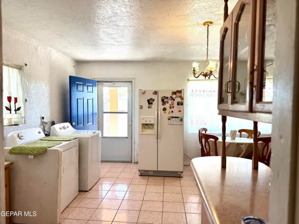 a view of a kitchen with appliances and cabinets
