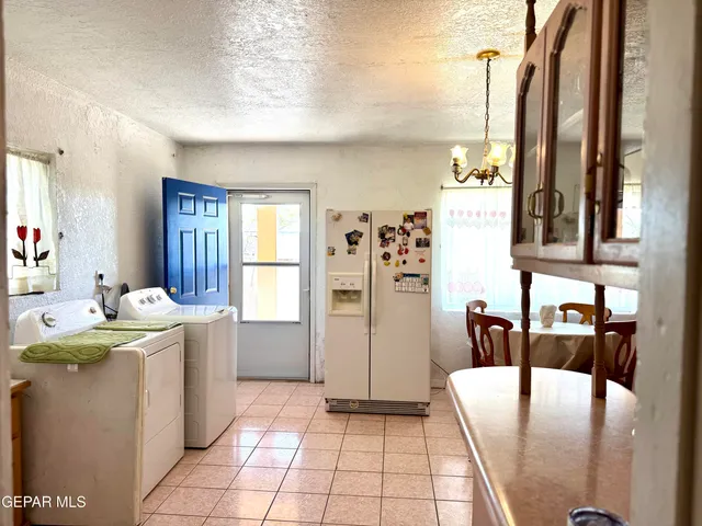 a view of a kitchen with appliances and cabinets