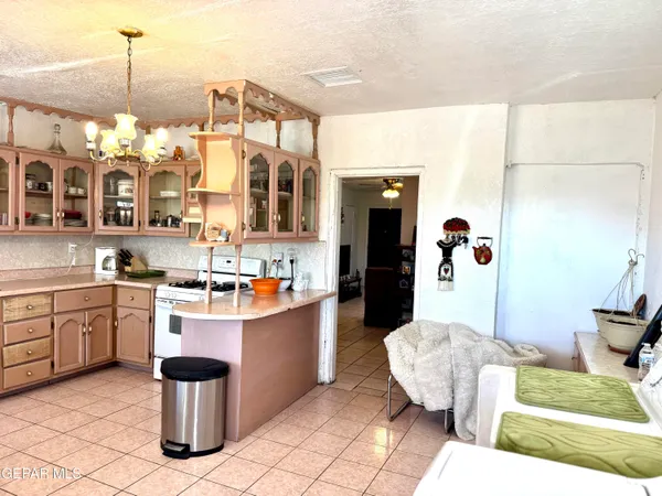 a kitchen with cabinets a sink and appliances
