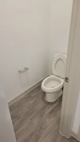 a view of a hall and an entryway in a room