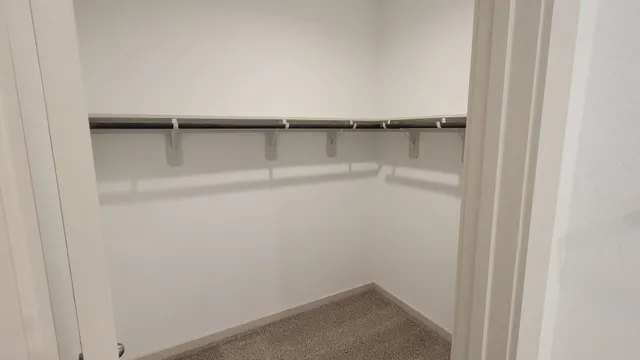 a bathroom with a sink mirror vanity and toilet