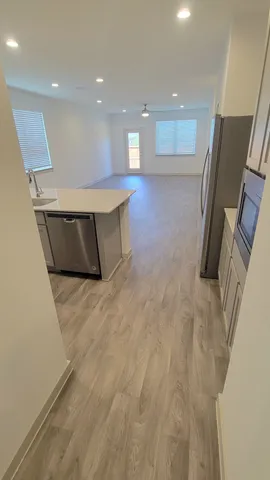 a bathroom with a sink a toilet and a shower