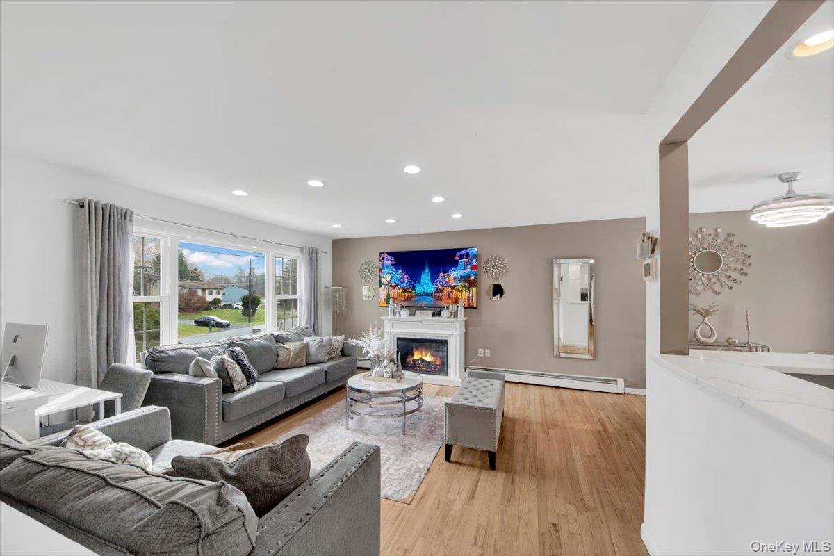 10 Scott Drive Middletown, NY 10941 - Photo 11 of 33 a living room with furniture flat screen tv and a fireplace