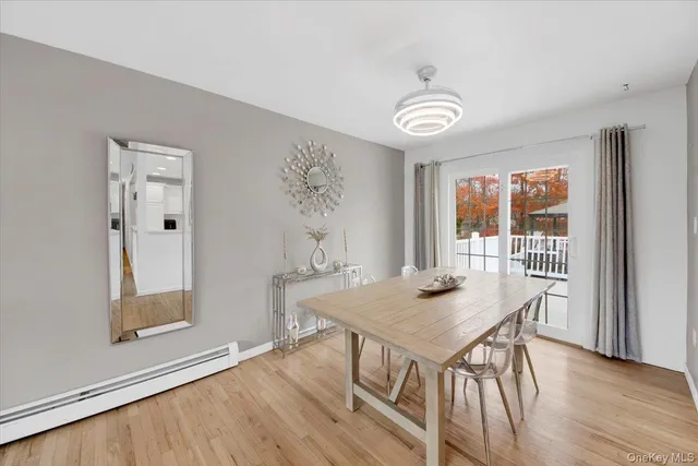 a view of a kitchen with furniture and wooden floor