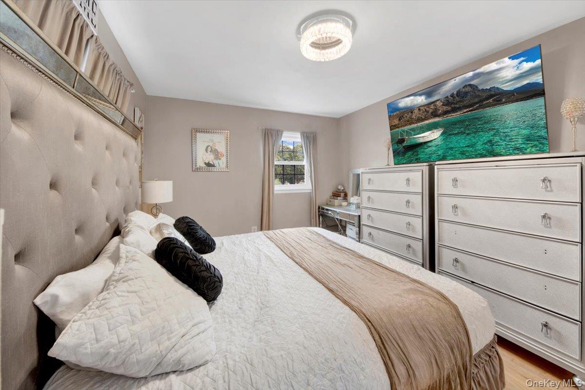 10 Scott Drive Middletown, NY 10941 - Photo 22 of 33 a bedroom with a large bed and a flat tv screen on dresser